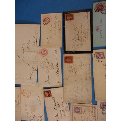 196 - A parcel of 19th century postal items to include Georgian letters and penny red stamps, all in used ... 