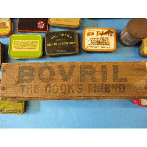 346 - A parcel of vintage tins and a Bovril wood crate, all in used condition with age-related marks