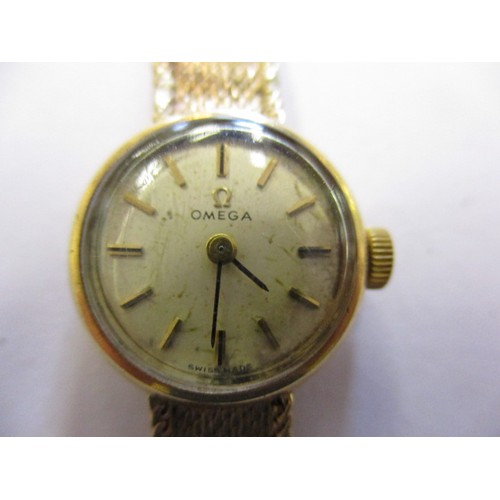 61 - Two gold cased ladies wristwatches and one other, 2 by Omega the other Tudor, not tested as to funct... 