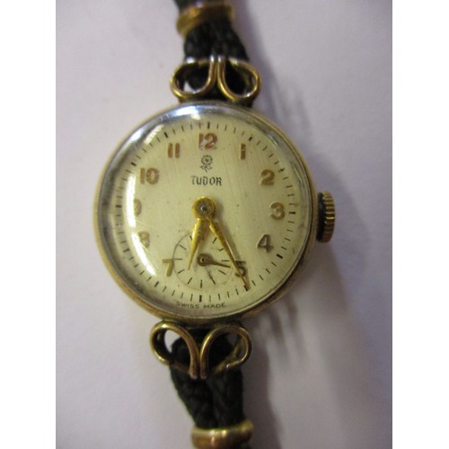 61 - Two gold cased ladies wristwatches and one other, 2 by Omega the other Tudor, not tested as to funct... 