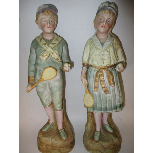 181 - Two late 19th century German Gebruder Huebach bisque porcelain tennis player figures, the girl havin... 