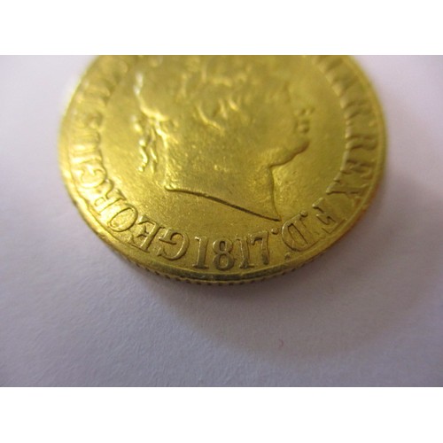 99 - A George III gold sovereign dated 1817, in a reasonable grade for age