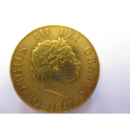 79 - A George III gold half sovereign dated 1817, a crisp reasonable grade coin with light signs of use