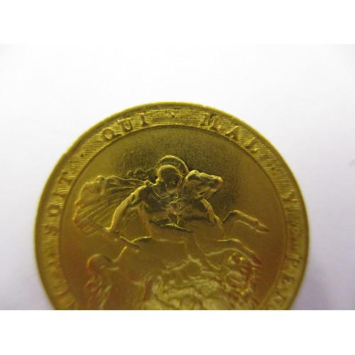 98 - A George III gold sovereign dated 1820, a crisp nice grade coin with light signs of use, having a sm... 