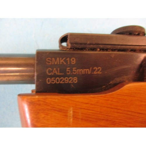 238 - A vintage SMK 19 .22 break barrel air rifle, in working order with general age related marks