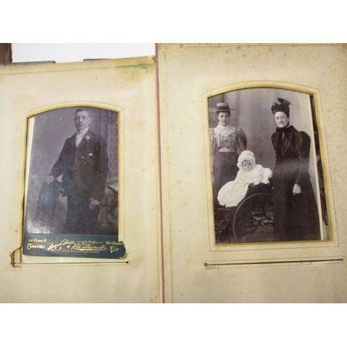 198 - A Victorian photo album with various 19th century and later photos, having ware to spine and edges a... 