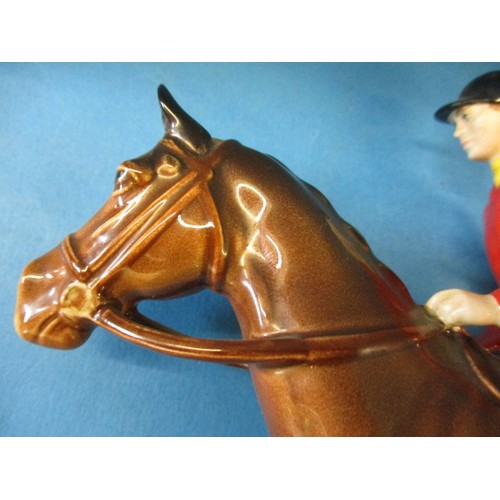 203 - A vintage Beswick 1501 huntsman on horse, 2 hounds and a fox.  The left front hoof shows signs of be... 