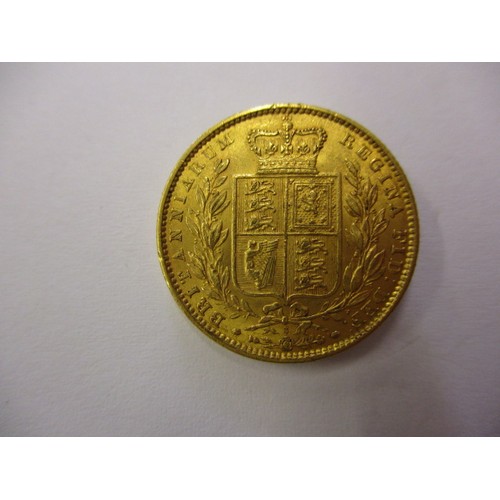 91 - An 1863 shield back sovereign, a fine grade coin, die number 3, a coin that’s been in circulation