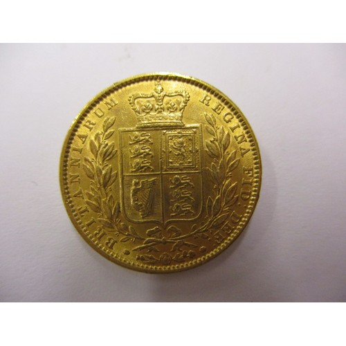 90 - An 1863 shield back sovereign, a fine grade coin, London mint, a coin that’s been in circulation