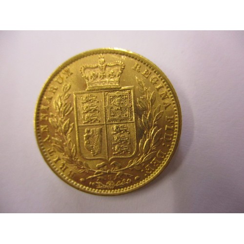 85 - An 1871 shield back sovereign, a fine grade coin with S mint mark, a coin that’s been in circulation