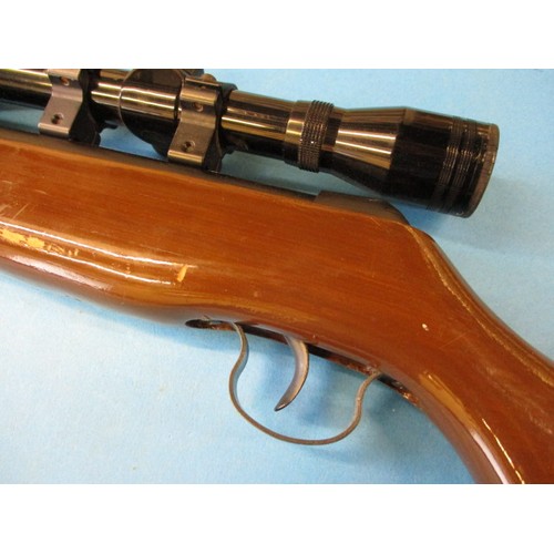 239 - A vintage break barrel .22 air rifle with 4x40 scope, in working order with general use related mark... 