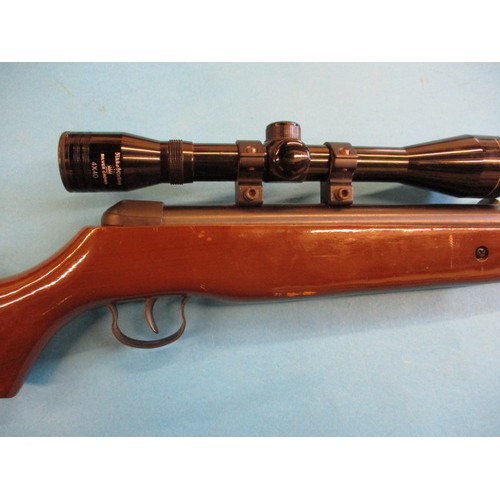 239 - A vintage break barrel .22 air rifle with 4x40 scope, in working order with general use related mark... 