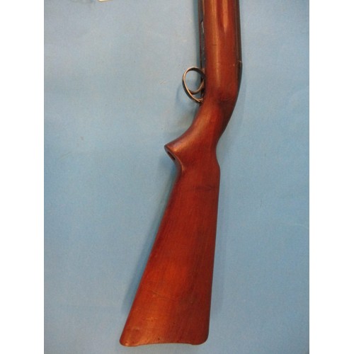 243 - A vintage BSA .22 under leaver air rifle, in working order with general use related marks, approx. l... 