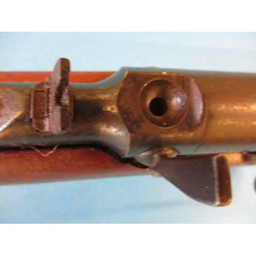 243 - A vintage BSA .22 under leaver air rifle, in working order with general use related marks, approx. l... 