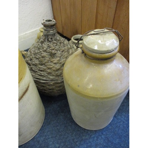 257 - A quantity of vintage stoneware jars and a glass terrarium, one with a crack and all with general ag... 