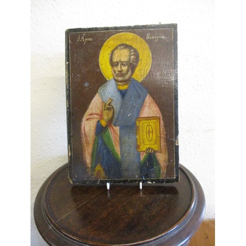 321 - A late 18th early 19th century painted wood panel depicting the Greek Saint Nicholas, a Saint coveri... 