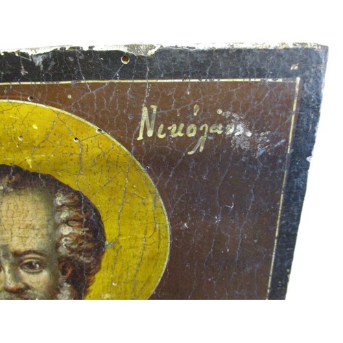 321 - A late 18th early 19th century painted wood panel depicting the Greek Saint Nicholas, a Saint coveri... 