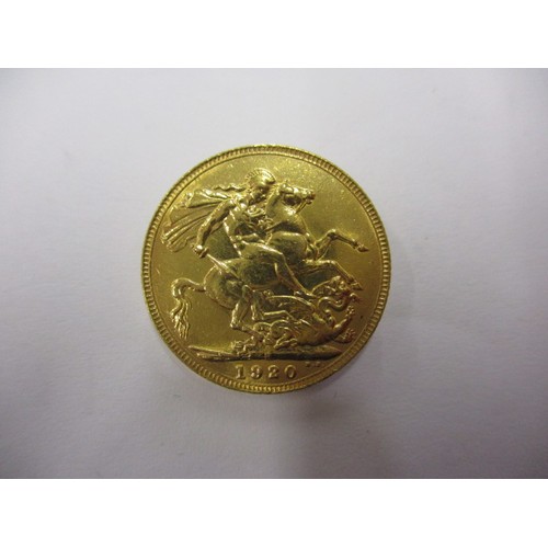 72 - A George V full gold sovereign dated 1920, a BV grade coin that’s been in circulation