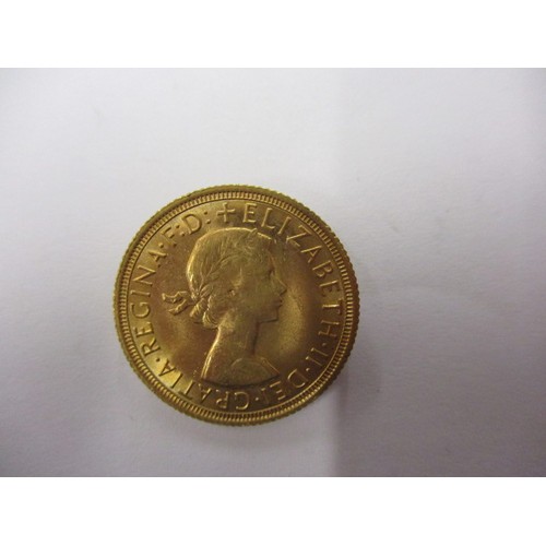 71 - A Queen Elizabeth II full gold sovereign dated 1968, a good grade coin that’s possibly been in a mou... 