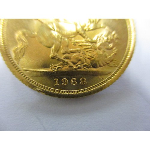 71 - A Queen Elizabeth II full gold sovereign dated 1968, a good grade coin that’s possibly been in a mou... 