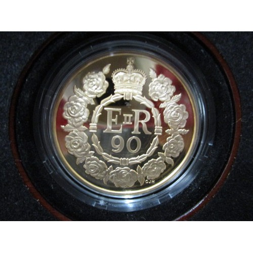 104 - A 2016 Royal Mint proof £5 coin, a limited edition for the 90th birthday of QEII in box and with pap... 