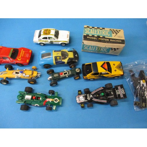 335 - A large quantity of vintage Scalextric model motor racing items, to include cars track and track sid... 