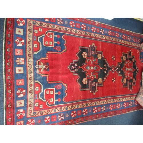 339 - A vintage Persian wool rug, approx. size 150cm x 200cm in used condition and retaining good colour w... 