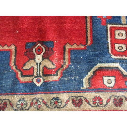 339 - A vintage Persian wool rug, approx. size 150cm x 200cm in used condition and retaining good colour w... 