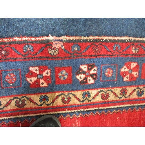 339 - A vintage Persian wool rug, approx. size 150cm x 200cm in used condition and retaining good colour w... 