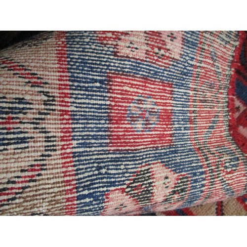 339 - A vintage Persian wool rug, approx. size 150cm x 200cm in used condition and retaining good colour w... 