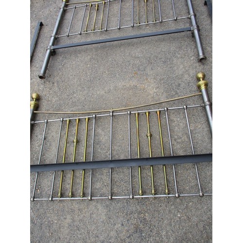 342 - A vintage polished iron and brass double bed frame, in good useable condition with use related marks... 