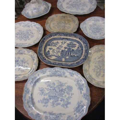 209 - A quantity of 19th century Blue & White platters, most in the Asiatic pheasant design, includes a tu... 