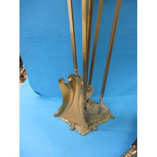 216 - A vintage brass 3 piece companion set on stand with a set of bellows, some tarnishing so in need of ... 