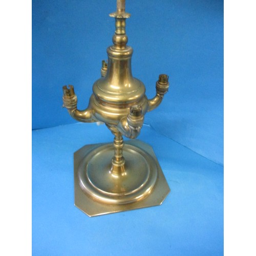 219 - An early 20th century brass 4 branch candle stick, having been converted to electric but needs a rew... 