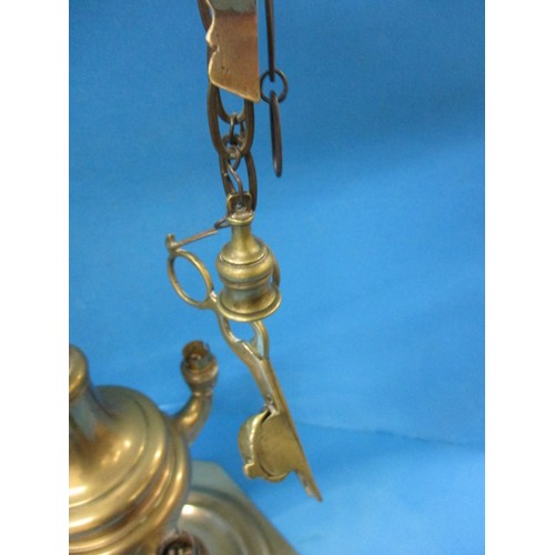 219 - An early 20th century brass 4 branch candle stick, having been converted to electric but needs a rew... 