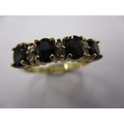 1 - A 9ct yellow gold dress ring with 4 sapphires separated by 3 pairs of diamonds, approx. ring size L ... 