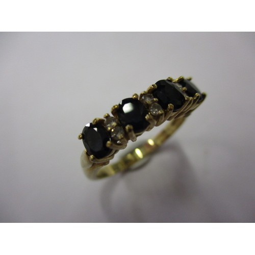 1 - A 9ct yellow gold dress ring with 4 sapphires separated by 3 pairs of diamonds, approx. ring size L ... 