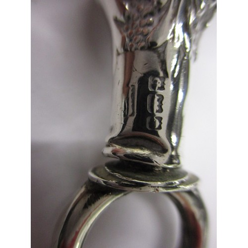 113 - An Edwardian sterling silver baby rattle with whistle, missing bells and some denting, approx. weigh... 