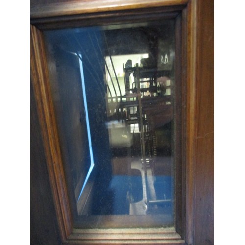 186 - An Edwardian walnut cased mantle clock with gilt metal mounts and turned spandrils, in need of resto... 