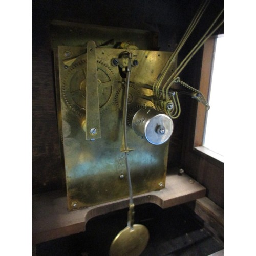 186 - An Edwardian walnut cased mantle clock with gilt metal mounts and turned spandrils, in need of resto... 