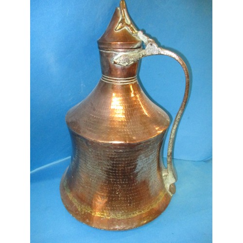 225 - A large antique Persian copper water jug, in good condition with general age-related marks, approx. ... 