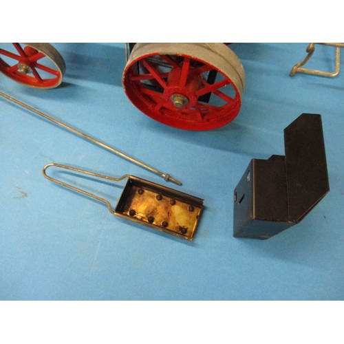 144 - A boxed Mamod live steam tractor with steering rod and pan, in used condition with use-related marks... 