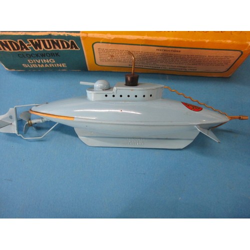 150 - A vintage Sutcliffe tinplate ‘Unda-wunda’ clockwork diving submarine in original box but no key. Lot... 