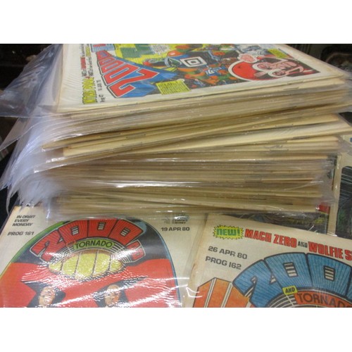 159 - Over 150 ‘2000AD’ comics dating from the 1970s and later, some still have free gifts attached to fro... 