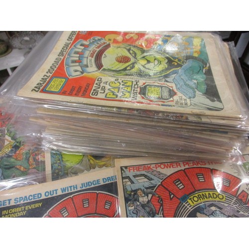 159 - Over 150 ‘2000AD’ comics dating from the 1970s and later, some still have free gifts attached to fro... 