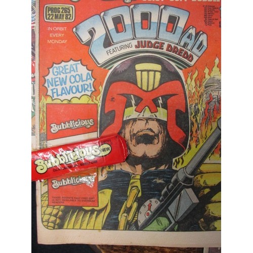 159 - Over 150 ‘2000AD’ comics dating from the 1970s and later, some still have free gifts attached to fro... 