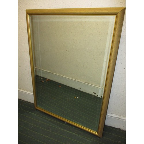 242 - A gilt framed bevelled glass wall mirror, approx. dimensions 110x85cm, in good clean condition