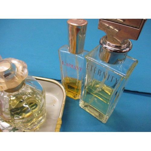 228 - A collection of vintage perfume in bottles, to include an example by Chanel, all in pre-owned condit... 