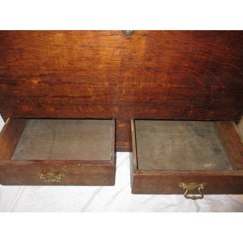 199 - An antique oak mule chest, being a storage box with lower drawers, in vintage condition with use rel... 