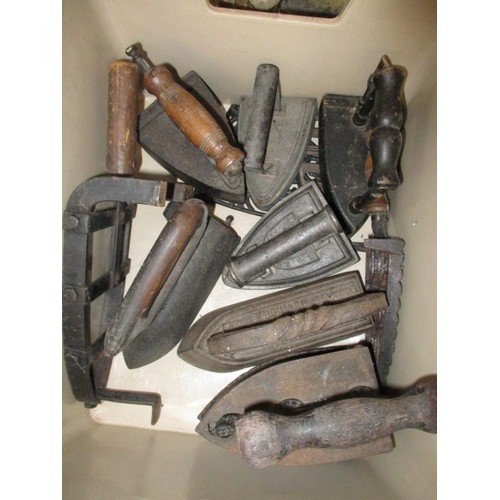 218 - A quantity of antique and later fireside items, to include copper coal hods a fender and flat irons,... 